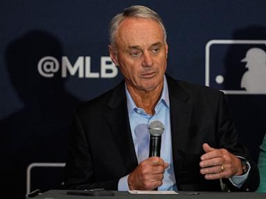 Source-feed image associated with MLB owners have proposed a salary cap for the first time since baseball's 1994-95 strike