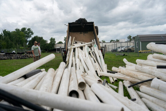 Image from linked report: PVC Pipes Swept Away by Helene Still Dominate Cleanup of NC River