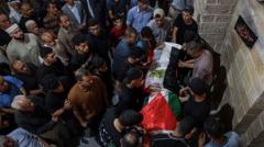 Source-feed image associated with Palestinians mourn Gaza World Cup screenings organiser killed in Israeli strike