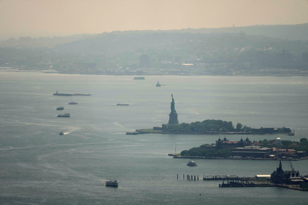 Source-feed image associated with Thunderstorms will clear wildfire smoke from Northeast ahead of World Cup final, meteorologists say