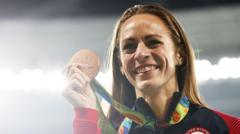 Source-feed image associated with US Olympic medallist Simpson collapses at mile event
