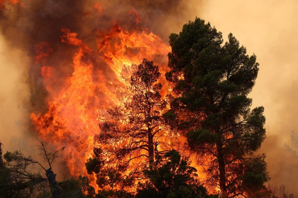 Source-feed image associated with 2 killed when firefighting helicopters collide near Athens as Europe's wildfire emergency rages