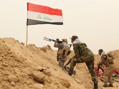 Source-feed image associated with As the last US troops pack up in Iraq, militias signal their weapons will stay