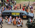 Source-feed image associated with Burial of King Oyo takes place in Uganda as news anchor prepares for throne