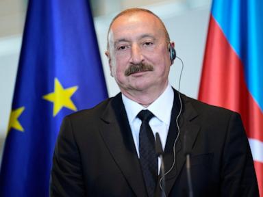 Source-feed image associated with Azerbaijan court convicts 9 journalists and activists in a case seen as an attack on media freedom