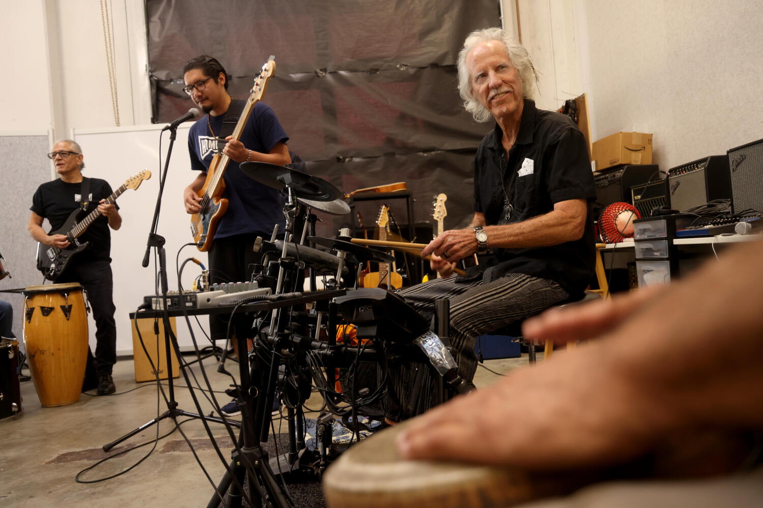 Image from linked report: Lopez: Doors drummer John Densmore jams at Homeboy: 'Maybe I can do something here'