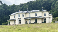 Source-feed image associated with We all share a 15-acre Georgian mansion for the price of a two-bed house