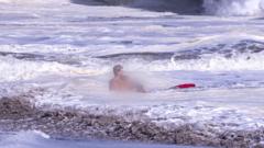 Source-feed image associated with Bystander video shows teen lifeguard's dramatic ocean rescue