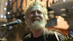 Source-feed image associated with Glen Hansard: A life in song and stories