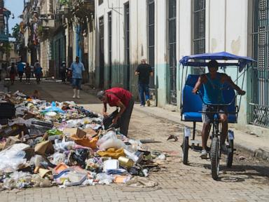 Source-feed image associated with A garbage crisis engulfs Havana as fuel shortages stall trash pickup
