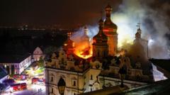 Source-feed image associated with Russian strikes kill nine and set historic cathedral in Kyiv ablaze