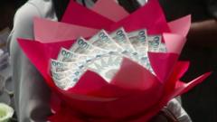Image from linked report: Seven arrested for using Ghanaian banknotes to make 'money bouquets'