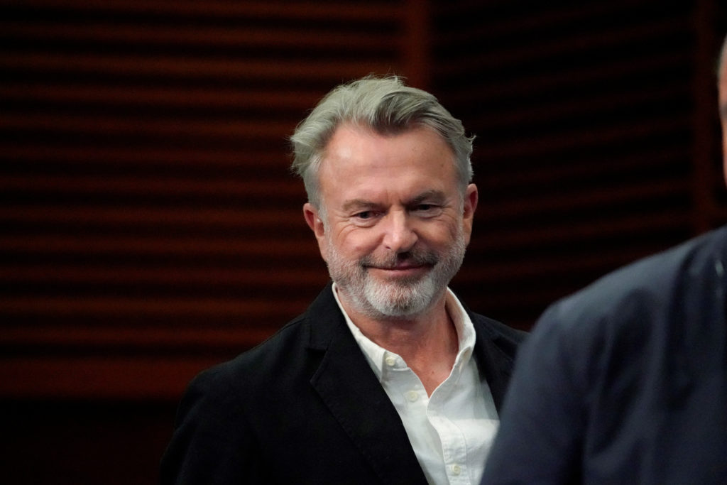 Source-feed image associated with 'Jurassic Park' star Sam Neill died from pneumonia, agent says