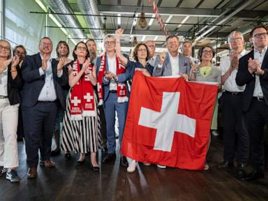 Source-feed image associated with Swiss cast ballots on right-wing's bid to cap country's population at 10 million