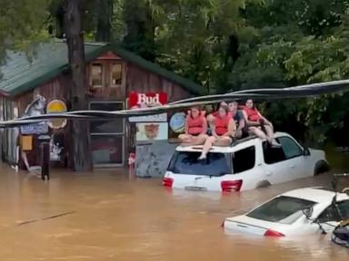 Source-feed image associated with Missouri flooding: Campers rescued after building collapses into floodwaters