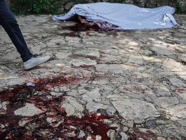Source-feed image associated with Haitians demand answers from police after gangs kill 47, kidnap more than 50