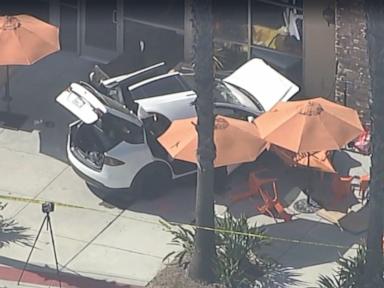 Source-feed image associated with Tesla crashes into cafe in Simi Valley, killing 1 and injuring 5