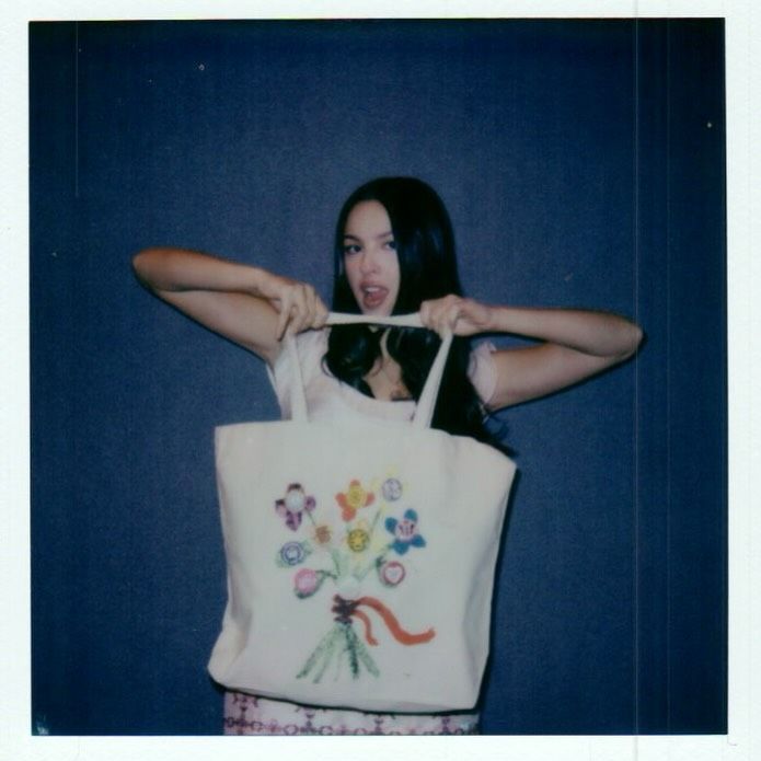 Source-feed image associated with Olivia Rodrigo’s First Daisy Chain Fields Festival Look Comes With a Feminist Message