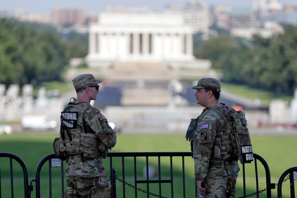 Source-feed image associated with D.C. will pay $50,000 to man detained while protesting guard patrol with 'Star Wars' song, record says