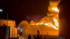 Source-feed image associated with Libyan authorities battle big blaze at major oil refinery