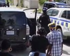 Source-feed image associated with Jamaican police officer charged with murder after woman shot during protest