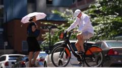 Source-feed image associated with Millions in Canada swelter as heatwave continues to move east