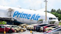 Source-feed image associated with Amazon pauses work with cargo firm after fatal crash