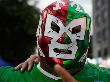 Source-feed image associated with Masked wrestlers flood Mexico’s World Cup streets as fans embrace lucha libre fever