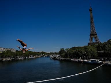 Source-feed image associated with High divers take the plunge in the Seine in a new test of Paris’ reclaimed river