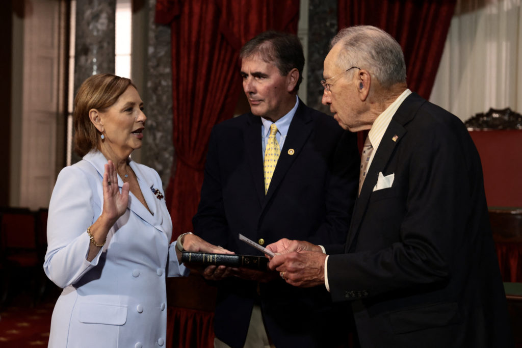 Source-feed image associated with WATCH: Darline Graham sworn in as senator after her brother's death