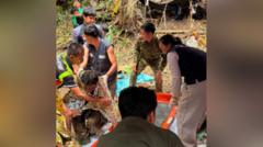 Source-feed image associated with Four more men freed from flooded Laos cave after 10 days