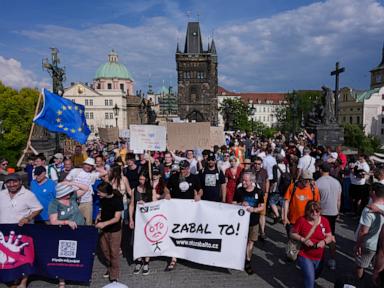 Source-feed image associated with Czechs rally against a government plan to overhaul the funding of public broadcasters
