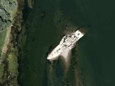 Source-feed image associated with A historic boat emerges in Serbia as Europe's rivers run dry from drought and heat