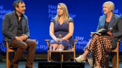 Source-feed image associated with Facebook whistle-blower sits in silence in panel discussion about her tell-all book
