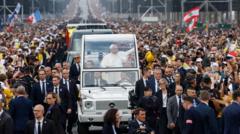 Image from linked report: Huge crowds greet Pope in Paris for open-air Mass