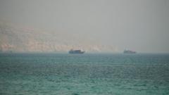 Source-feed image associated with Iran must pledge to stop shooting at ships in Strait of Hormuz, US officials say