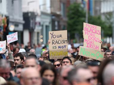 Source-feed image associated with Thousands rally in Belfast to condemn anti-immigrant rioting that followed stabbing