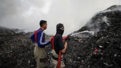 Source-feed image associated with A mountain of rubbish in Indonesia has been on fire for more than a week