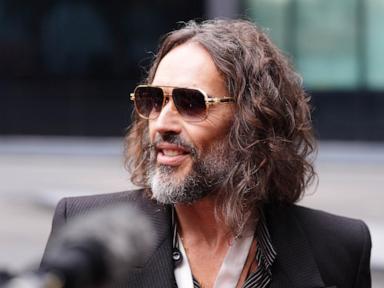 Image from linked report: Prosecution labels Russell Brand 'ruthless sexual predator' at opening of trial