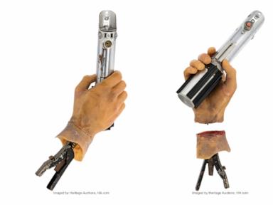 Source-feed image associated with Luke's 'Empire' light saber, 'Wizard of Oz' witch hat, Lebowski rugs up for auction