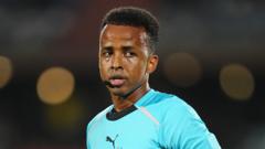 Source-feed image associated with Somali referee denied entry to US to receive full World Cup pay, sources say
