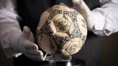 Source-feed image associated with Maradona's 'Hand of God' ball sells for £2.5m