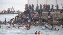 Source-feed image associated with EU calls for stronger borders after Ceuta migrant crossings