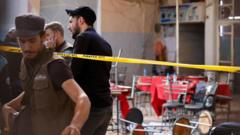 Source-feed image associated with Bomb blast at Damascus cafe kills nine, Syrian state media say