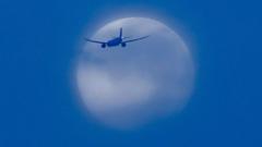 Image from linked report: Your pictures of the Harvest Moon shimmering across the UK sky