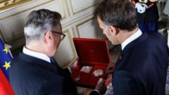 Source-feed image associated with Starmer becomes first UK PM to receive top French honour