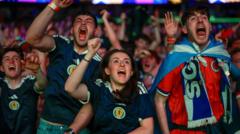 Source-feed image associated with Jubilation as Scotland fans celebrate win