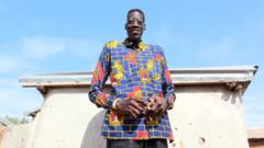 Source-feed image associated with Ghana mourns its tallest man - a 'generous and popular giant'