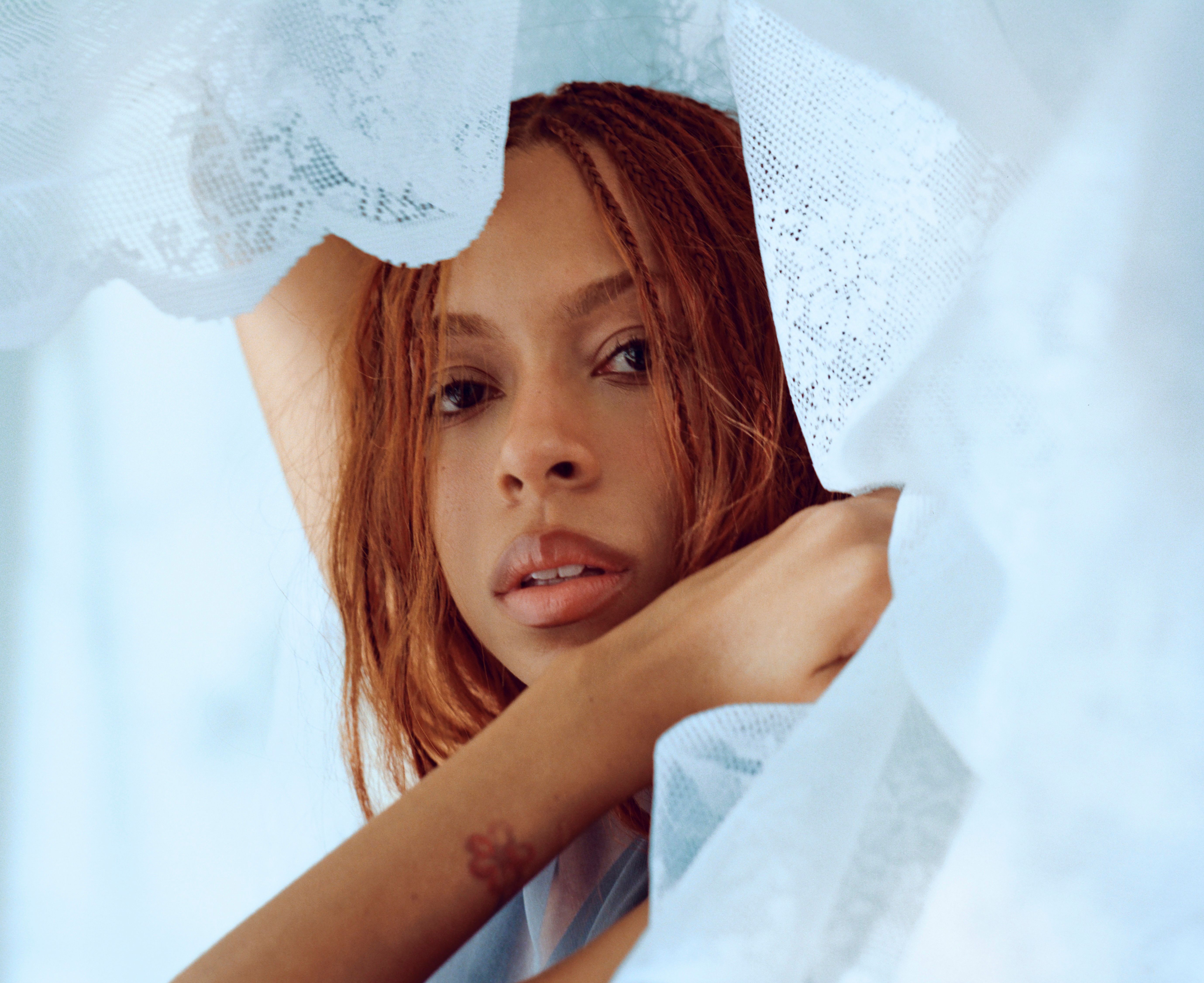 Source-feed image associated with 11 New Albums You Should Listen to Now: Ravyn Lenae, Karol G, and More