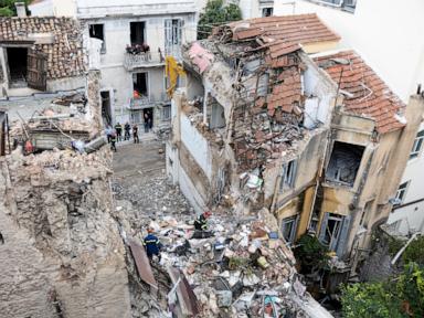 Image from linked report: Rescuers pull 2 unconscious from collapsed building near the Acropolis in Greece